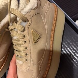 Prada Women’s mid top sneakers.